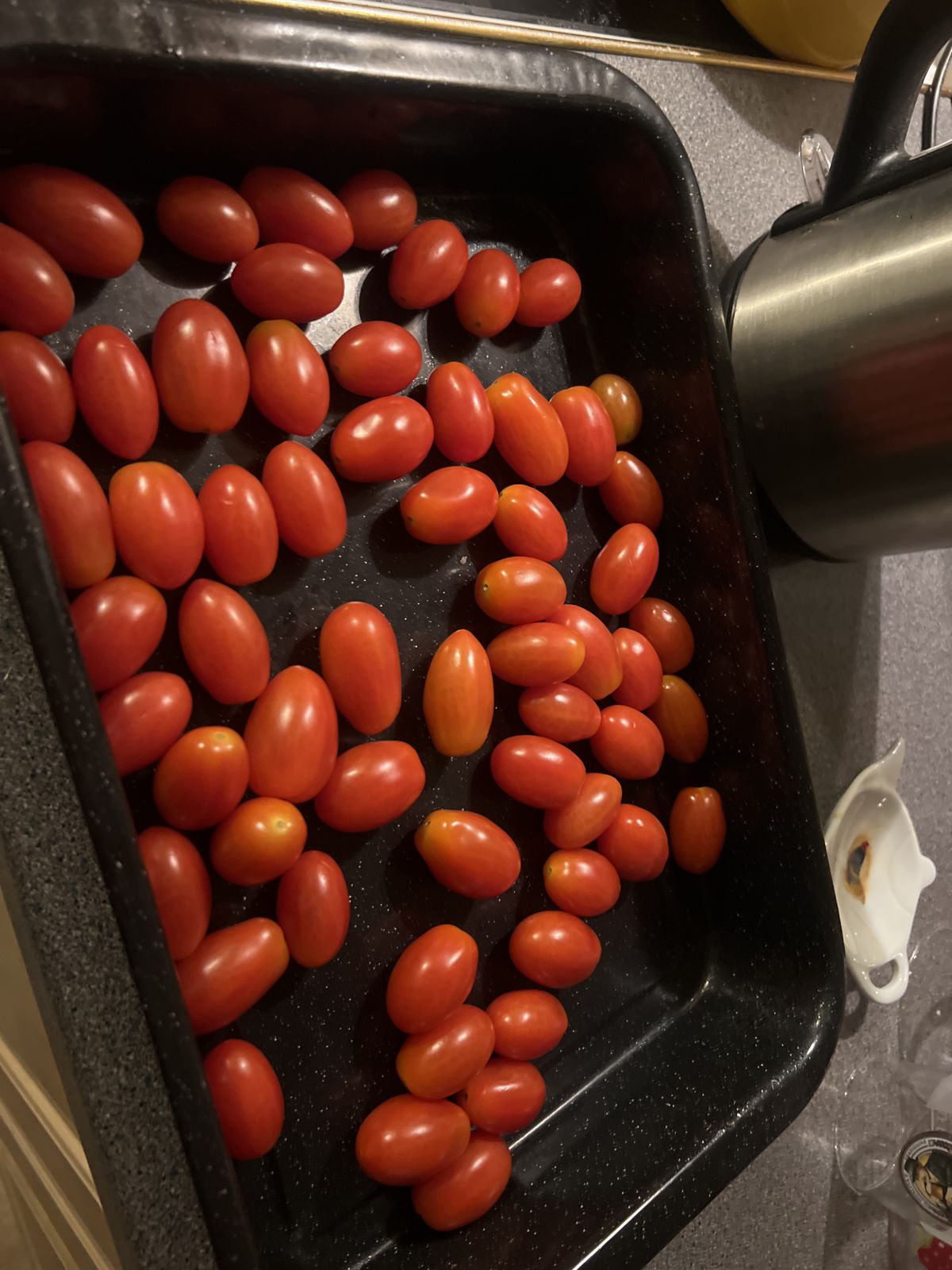 Tomatoes in a roasting tray before roasting