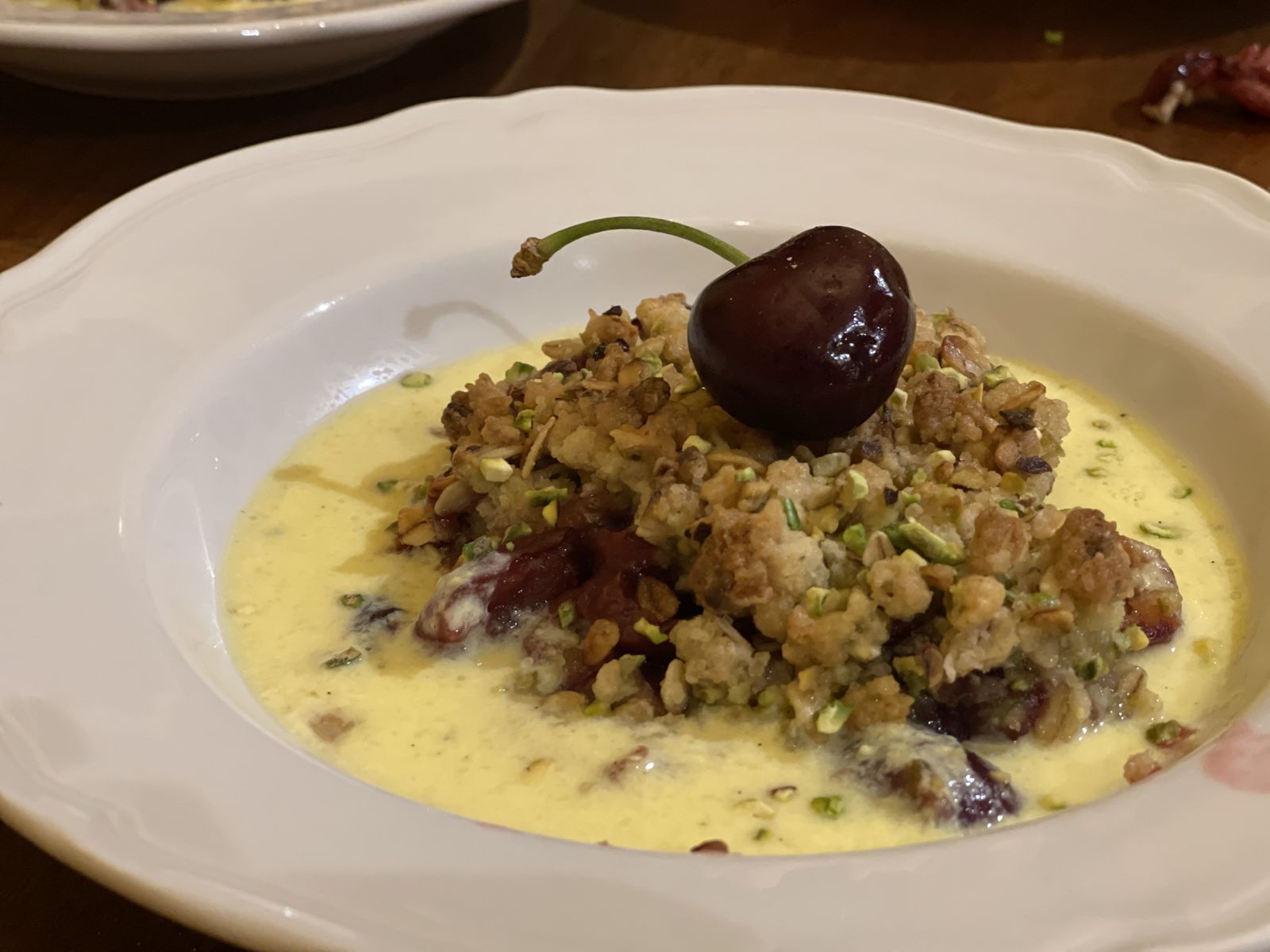 Cherry and pistachio crumble with custard